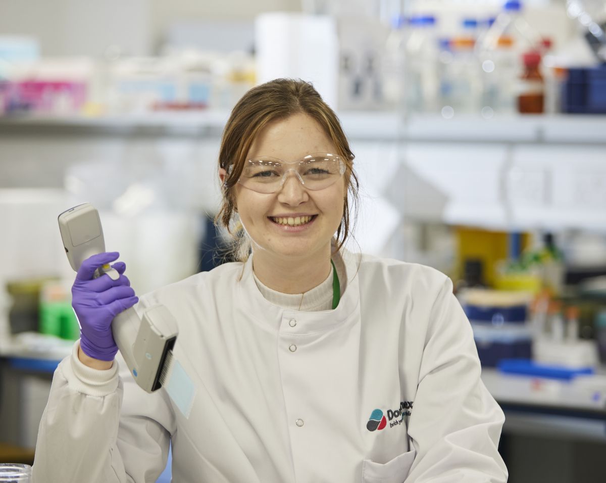 Domainex team member smiling in the lab