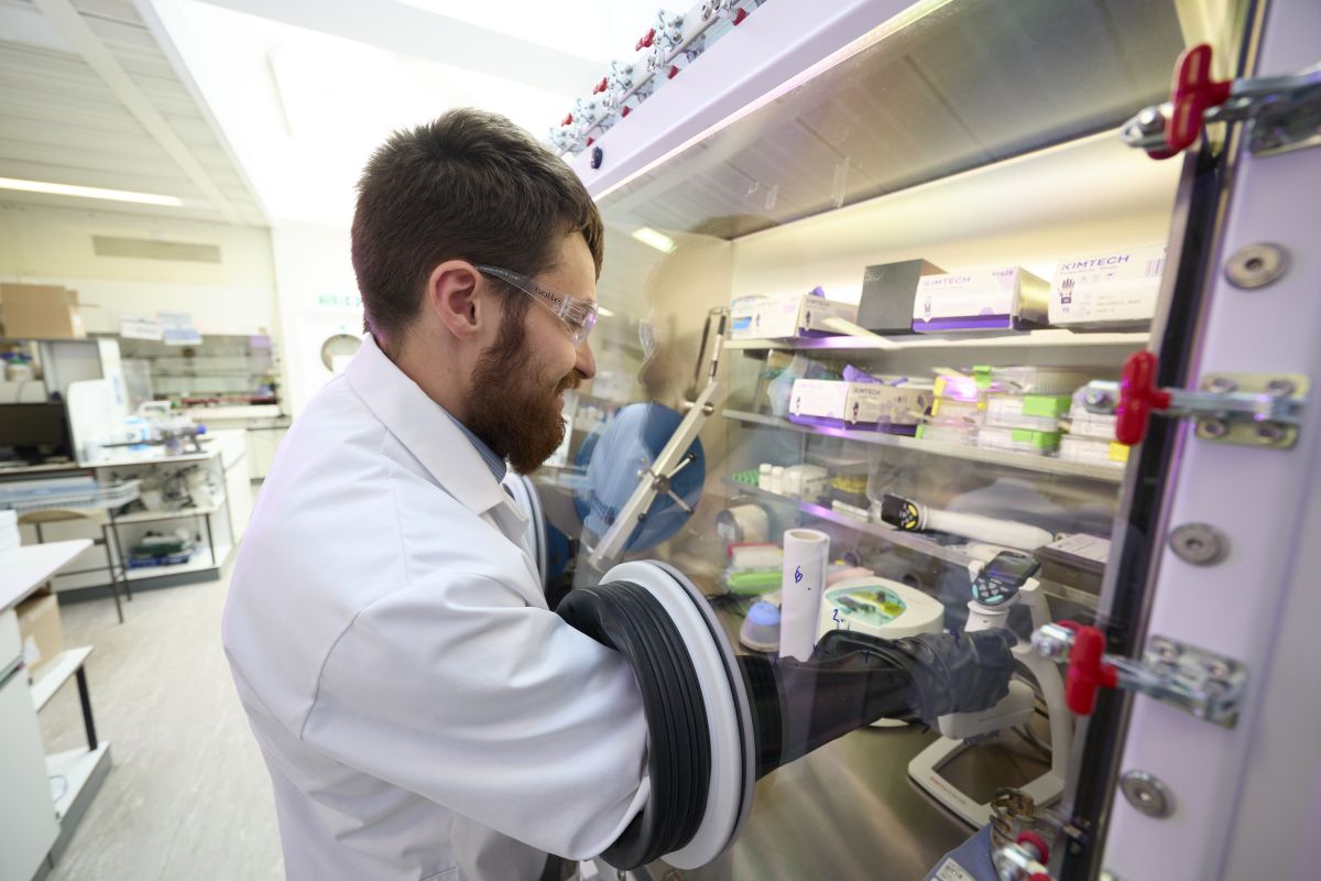 Scientist working in glove box on direct to biology project